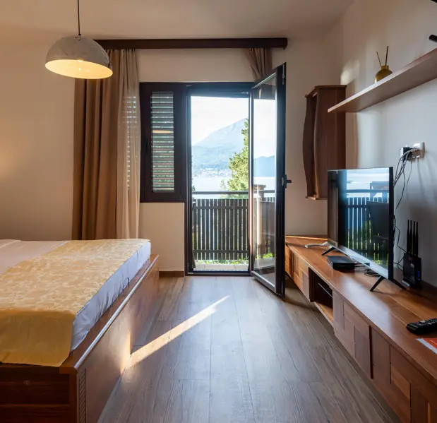 Deluxe Suite bedroom with sea view at Forte Rose